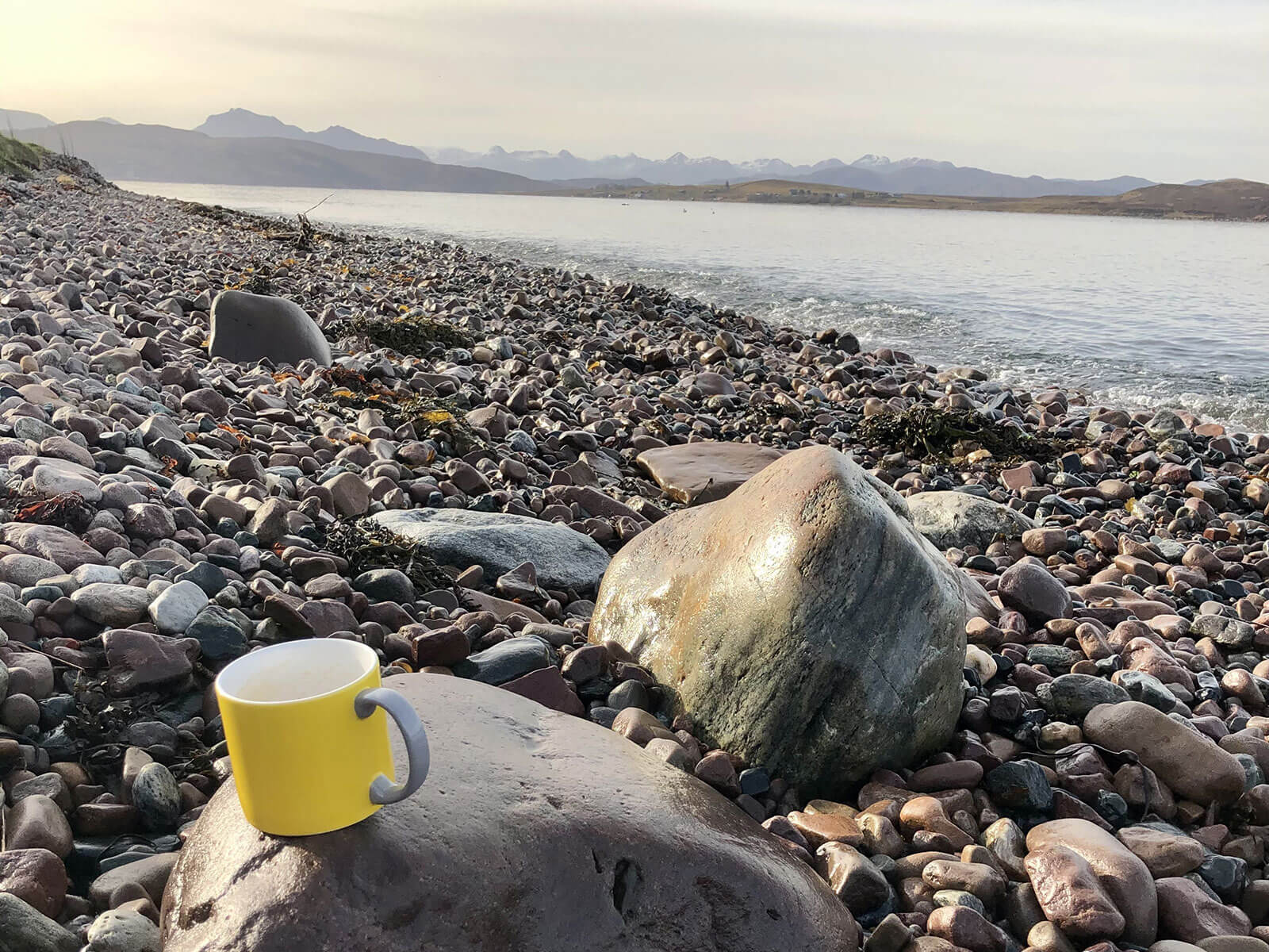 Coffee mug by the beach