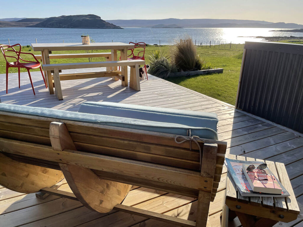 Outdoor seating benches and table with books